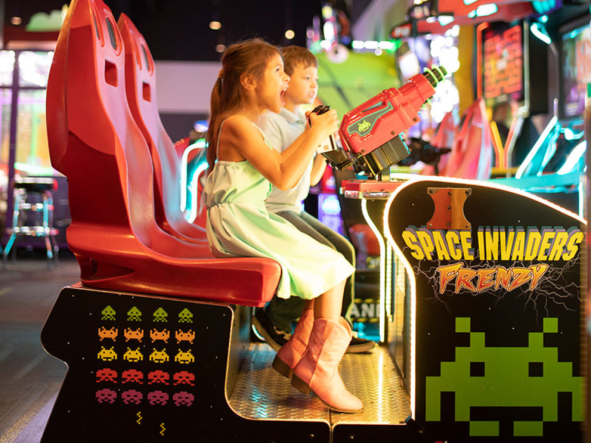 kids playing arcade games together