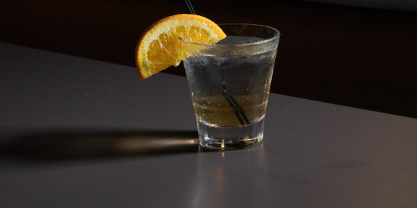 Cocktail with orange wedge
