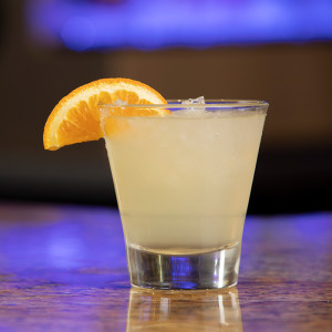 Cocktail with orange wedge