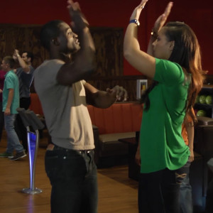 Two people going for double high-fives