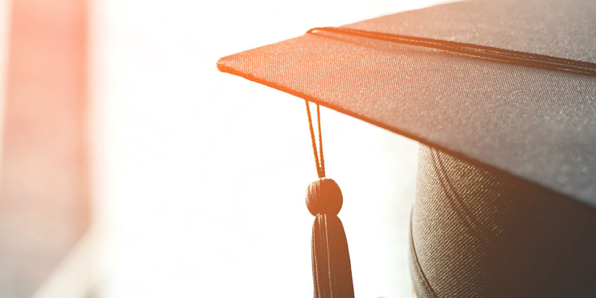 A close-up of a graduation cap with a tassel hanging down. The background is softly blurred, and warm sunlight illuminates the scene, reminiscent of the joyful spirit found at Spare Time Texas.