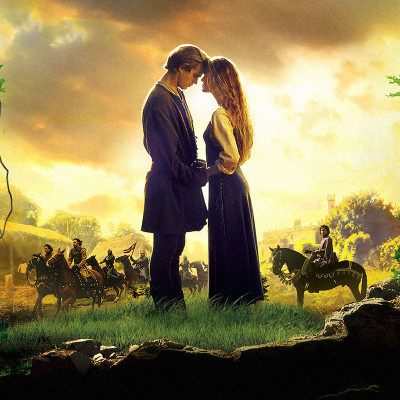 A man and woman stand closely, gazing into each other's eyes on a grassy hill at sunset. In the background, like cowboys riding across Texas plains, a group of riders approach. Nearby, a family fun center buzzes with laughter, its neon lights softly glowing under the golden sky.